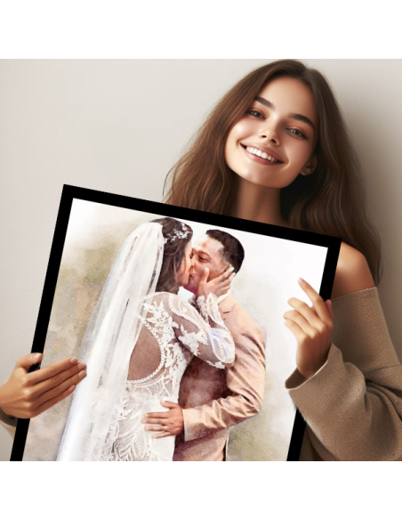 Holding a canvas of a wedding couple done in watercolor, and framed in black.