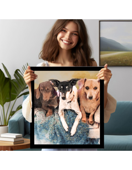 A lady displaying a canvas watercolor photo art canvas of three dogs in a black frame