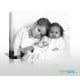artist digitally drawing of 2 babies on canvas from photo